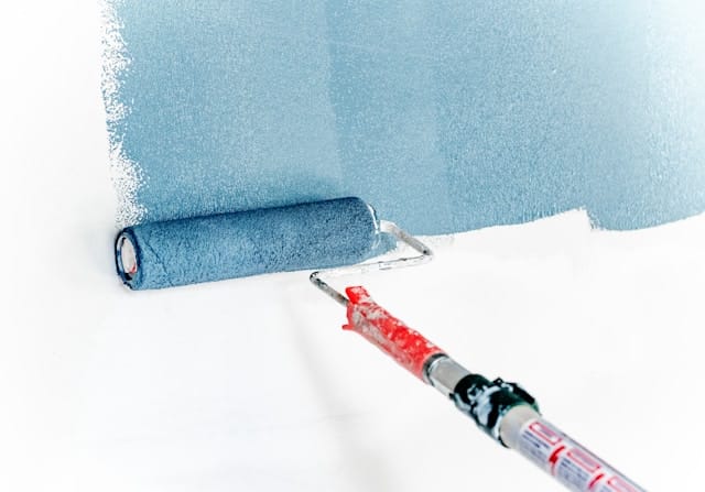 roller brush with sky blue paint