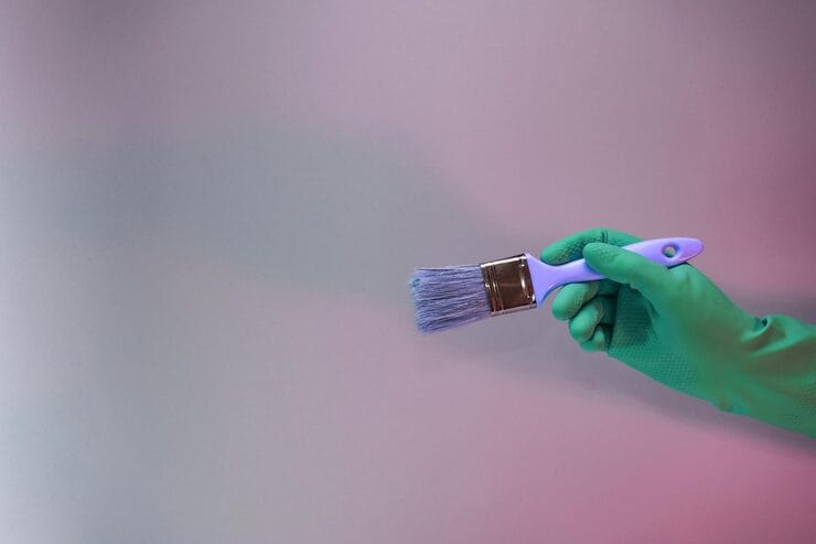 brush with paints behind