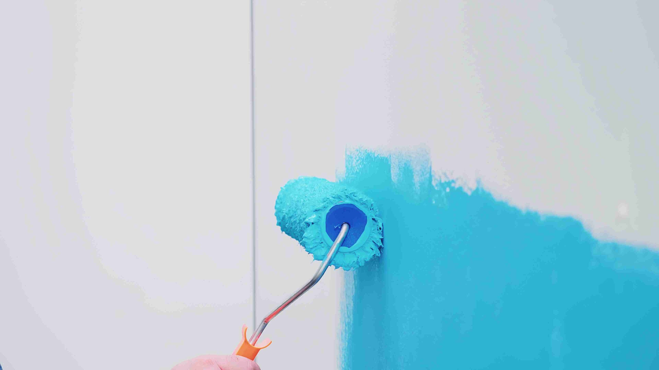 roller paint brush with blue paint